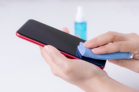 closeup-woman-hands-using-alcohol-spray-cleaning-smart-phone-against-disease-covid-19.jpg
